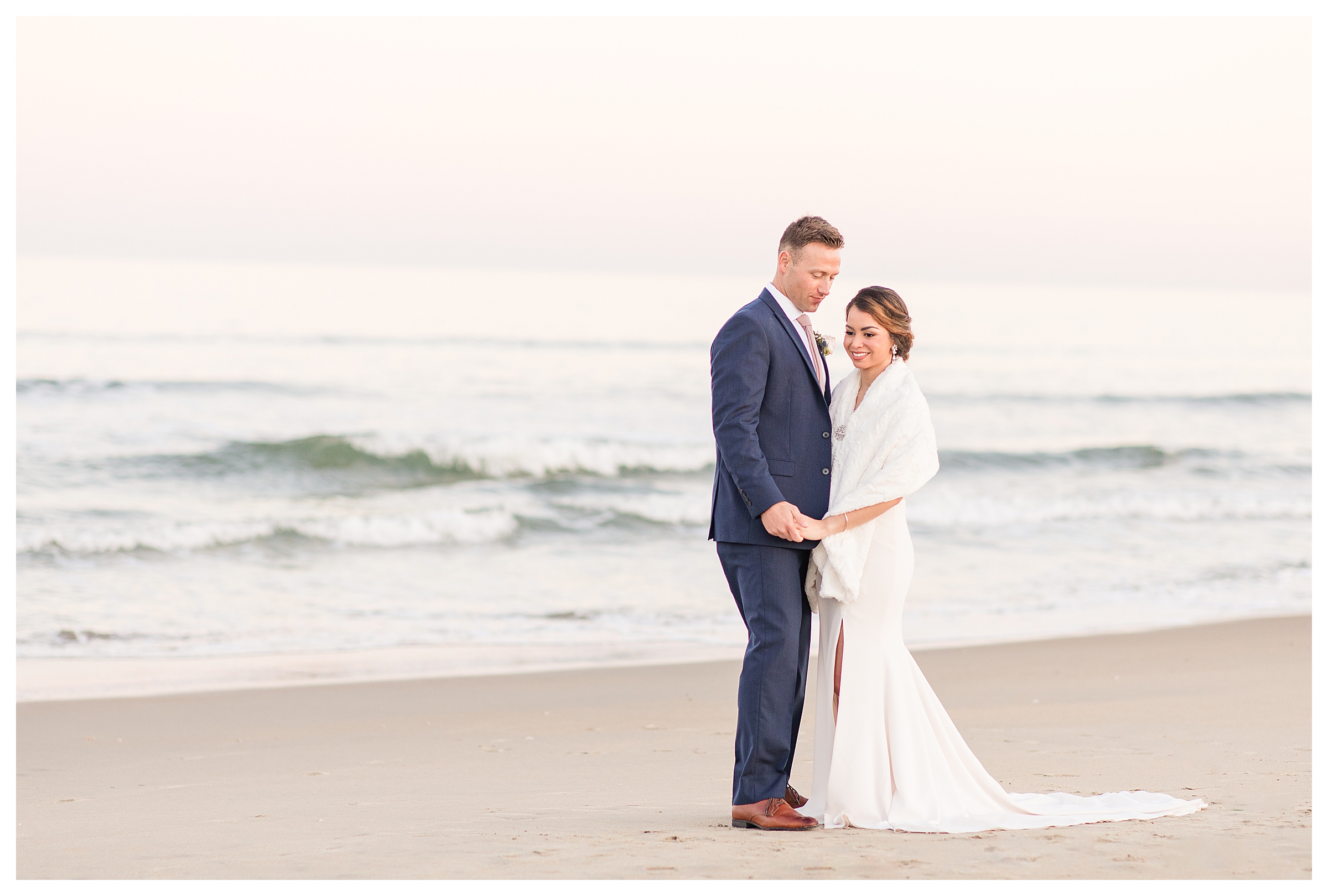 Bride and Groom on the beach with waves.