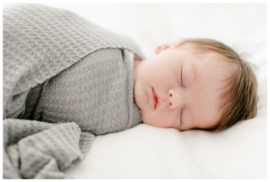 In home newborn portrait session, natural posing.