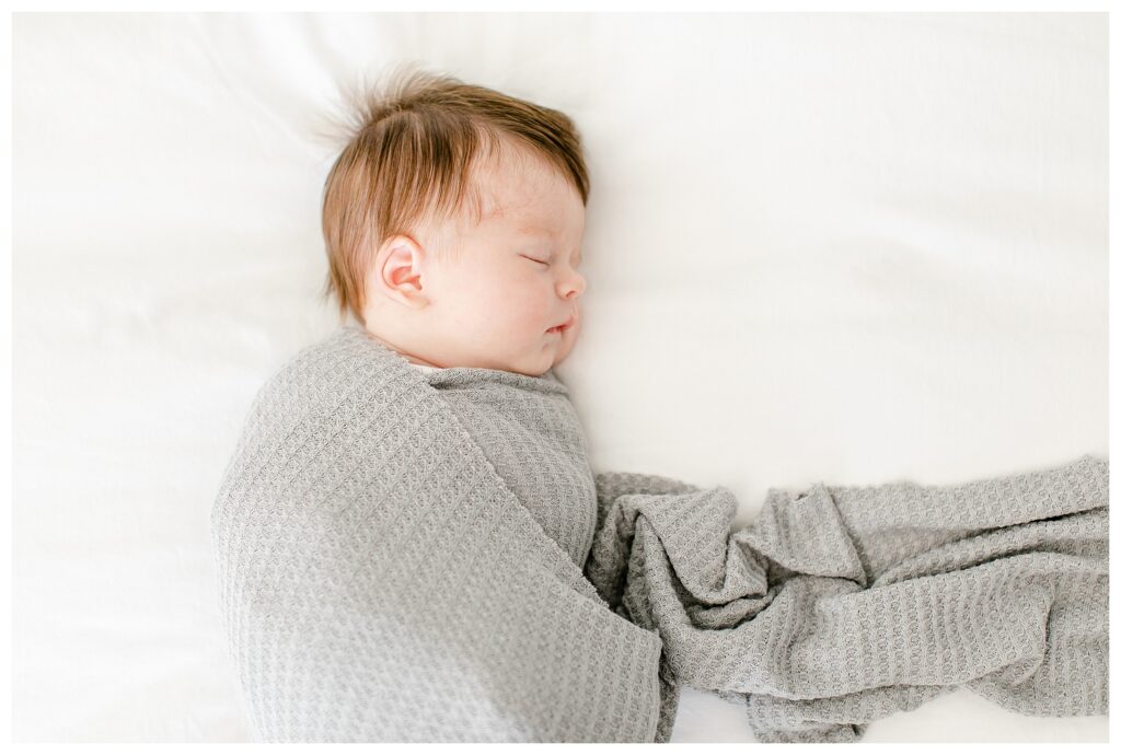 In home newborn portrait session, natural posing.