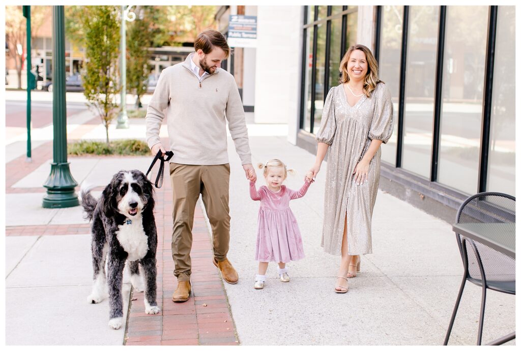 Family portraits in Town Center Virginia Beach with family dog.