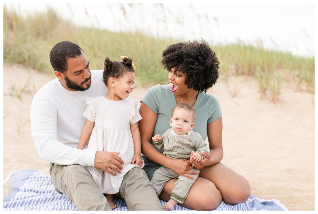Family beach portraits in Virginia beach with a family of four.